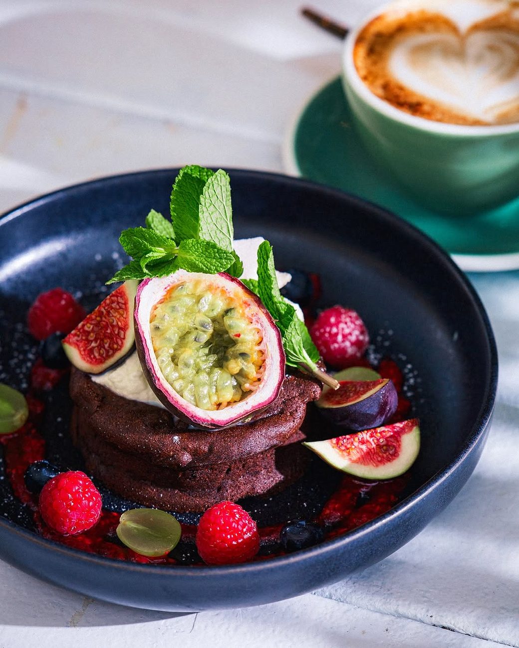 Chocolate fondant with berry coulis, figs and passionfruit